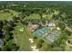 Aerial of golf course with swimming pool and tennis courts at 3964 Deer Run Ne Dr, Conover, NC 28613