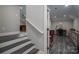 Basement with staircase leading to an office featuring wood floors, desk, and cabinets at 3964 Deer Run Ne Dr, Conover, NC 28613