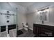 Bathroom features a glass-enclosed shower with tile surround and a modern vanity with a vessel sink at 3964 Deer Run Ne Dr, Conover, NC 28613
