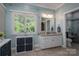 Bathroom with granite vanity and large window offering natural light and a view of lush greenery at 3964 Deer Run Ne Dr, Conover, NC 28613