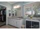 Bathroom featuring vanity, mirror, and a view to the exterior at 3964 Deer Run Ne Dr, Conover, NC 28613