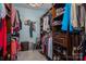 Walk-in closet with custom shelving, drawers, and ample storage space for clothes and shoes at 3964 Deer Run Ne Dr, Conover, NC 28613