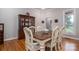 Traditional dining room with hardwood floors, a large table, and a china cabinet at 3964 Deer Run Ne Dr, Conover, NC 28613
