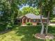 Beautiful brick home with mature trees and lush green lawn at 3964 Deer Run Ne Dr, Conover, NC 28613