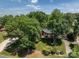 Traditional home with a well-manicured lawn and mature trees in a serene setting at 3964 Deer Run Ne Dr, Conover, NC 28613
