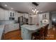 Kitchen featuring an island with marble countertops, white cabinetry, and stainless steel appliances at 3964 Deer Run Ne Dr, Conover, NC 28613