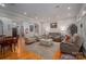 Open concept living room and dining room, with hardwood floors, neutral decor, and plenty of seating at 3964 Deer Run Ne Dr, Conover, NC 28613