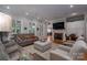 Comfortable living room featuring a fireplace, sofas, hardwood floors, and plenty of natural light at 3964 Deer Run Ne Dr, Conover, NC 28613