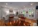 Bright living room with a fireplace, two sofas, and hardwood floors at 3964 Deer Run Ne Dr, Conover, NC 28613