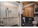 Modern bathroom showcasing a walk-in shower with white subway tile and black trim, plus a unique modern sink at 418 3Rd Ne St, Hickory, NC 28601