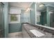 Bathroom with double sinks, granite countertop, and a framed mirror at 418 3Rd Ne St, Hickory, NC 28601