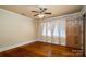 Bedroom featuring hardwood floors, light walls, curtains, and a ceiling fan at 418 3Rd Ne St, Hickory, NC 28601