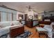 Cozy bedroom features hardwood floors, ceiling fans and sitting area at 418 3Rd Ne St, Hickory, NC 28601