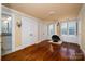 Cozy bedroom featuring hardwood floors, a retro fireplace, bright light from the windows and a view of the bathroom at 418 3Rd Ne St, Hickory, NC 28601
