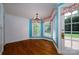 Bright breakfast nook featuring white brick walls, colorful paint, and large windows that bring in natural light at 418 3Rd Ne St, Hickory, NC 28601