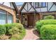 Charming brick walkway leading to the front door, surrounded by lush landscaping at 418 3Rd Ne St, Hickory, NC 28601