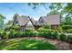 Beautiful two-story Tudor home with lush landscaping and well-manicured front yard at 418 3Rd Ne St, Hickory, NC 28601