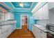 Spacious kitchen featuring custom cabinetry, stainless steel appliances and retro blue walls at 418 3Rd Ne St, Hickory, NC 28601