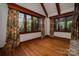 Bright living room with hardwood floors, large windows, and custom drapes at 418 3Rd Ne St, Hickory, NC 28601