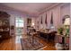 Bright and inviting living room featuring hardwood floors, vintage furniture, and large windows at 418 3Rd Ne St, Hickory, NC 28601