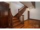 Elegant wood staircase with detailed banisters and hardwood floors at 418 3Rd Ne St, Hickory, NC 28601