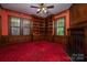 Cozy study with dark wood finishes, a fireplace, and a built-in bookcase at 418 3Rd Ne St, Hickory, NC 28601