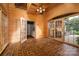 Sunroom boasting exposed wood paneling, French doors with access to a patio, and tile flooring at 418 3Rd Ne St, Hickory, NC 28601