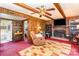 Finished basement with brick fireplace, wood paneling, and easy access to another room at 4603 Oakwood Cir, Gastonia, NC 28056