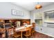 Bright dining area with wood table and a view of the fireplace and living room at 4603 Oakwood Cir, Gastonia, NC 28056