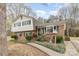 Inviting brick home with green shutters, a cozy front porch, and a well-maintained walkway at 4603 Oakwood Cir, Gastonia, NC 28056