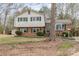 Charming two-story home with brick facade, green shutters, and a landscaped front yard at 4603 Oakwood Cir, Gastonia, NC 28056