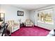 Bright living room with comfortable seating, window, and decorative accents at 4603 Oakwood Cir, Gastonia, NC 28056
