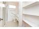 Cozy bathroom with glass shower, black and white tile, and shelving at 4625 Woodlark Ln, Charlotte, NC 28211