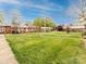 A serene neighborhood featuring well-maintained lawns and charming brick homes at 4625 Woodlark Ln, Charlotte, NC 28211