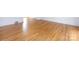 Beautiful hardwood flooring in a well-lit room with white walls and neutral trim at 4625 Woodlark Ln, Charlotte, NC 28211
