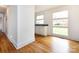 Bright kitchenette features stainless steel sink, white cabinets, and hardwood floors, perfect for a functional space at 4625 Woodlark Ln, Charlotte, NC 28211
