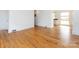 Bright living room featuring beautiful hardwood floors, white walls, and an open layout at 4625 Woodlark Ln, Charlotte, NC 28211