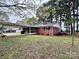 View of home with large yard with covered porch at 511 W Main St, Cleveland, NC 27013
