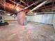 This is a basement view displaying the concrete flooring and utilities at 511 W Main St, Cleveland, NC 27013