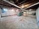 This is a basement view displaying the concrete flooring and utilities at 511 W Main St, Cleveland, NC 27013
