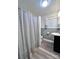 Updated bathroom features a vanity and a tub-shower with curtain at 511 W Main St, Cleveland, NC 27013