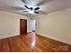 Bright bedroom with hardwood floors and a ceiling fan at 511 W Main St, Cleveland, NC 27013