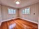 Cozy bedroom with hardwood floors and large windows offers ample natural light at 511 W Main St, Cleveland, NC 27013