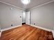 Bedroom with hardwood floors and white trim at 511 W Main St, Cleveland, NC 27013