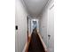 Hallway with fresh paint and carpet leads to other areas of the home at 511 W Main St, Cleveland, NC 27013