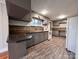 Well-lit kitchen featuring gray cabinetry, updated countertops, and modern appliances, offering functionality and style at 511 W Main St, Cleveland, NC 27013