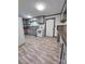 Functional kitchen featuring gray cabinets, laminate counters, and modern appliances, ready for culinary adventures at 511 W Main St, Cleveland, NC 27013