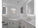 Modern bathroom with double sink vanity, large tub, and marble countertops at 5680 Gold Creek Bay None, Hickory, NC 28601