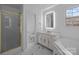 Well-lit bathroom featuring a shower, tub, sleek fixtures, and vanity with marble countertops at 5680 Gold Creek Bay None, Hickory, NC 28601