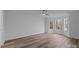 Bedroom with wood-look floors, natural light from large windows, and ceiling fan at 5680 Gold Creek Bay None, Hickory, NC 28601